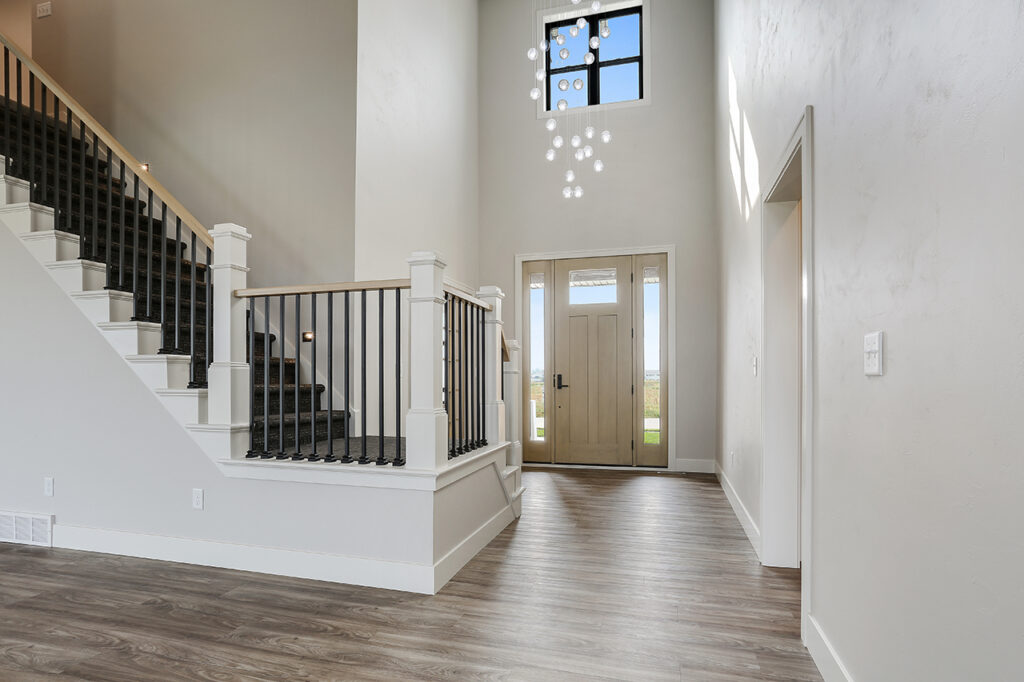 grady-entryway-with-grand-staircase-chandelier