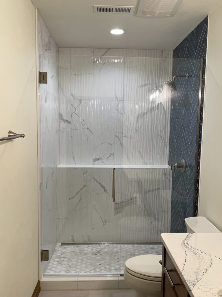 floor-to-ceiling-marble-shower-in-greenville-wi-basement
