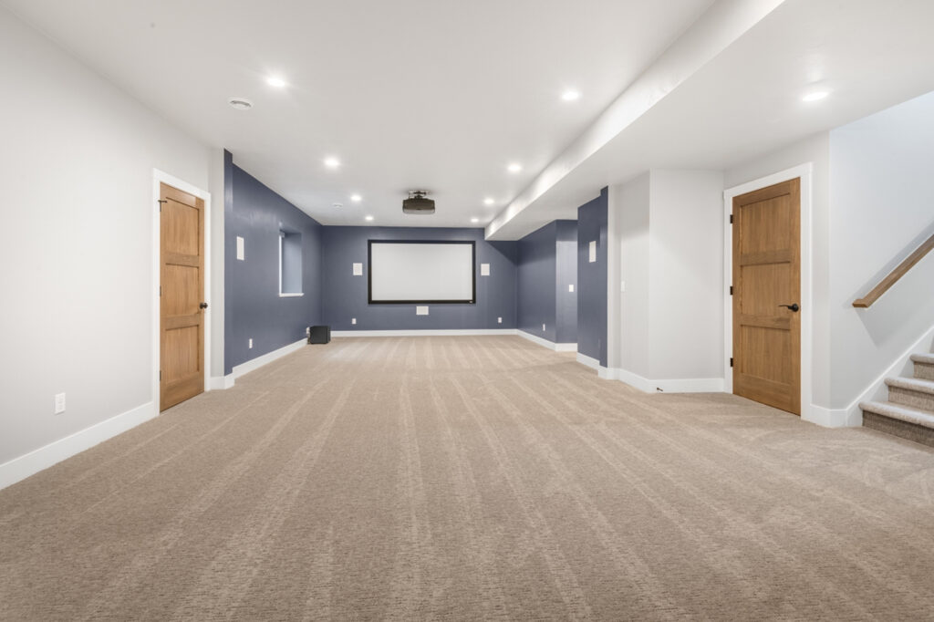 private-home-theater-with-slate-blue-accent-wall