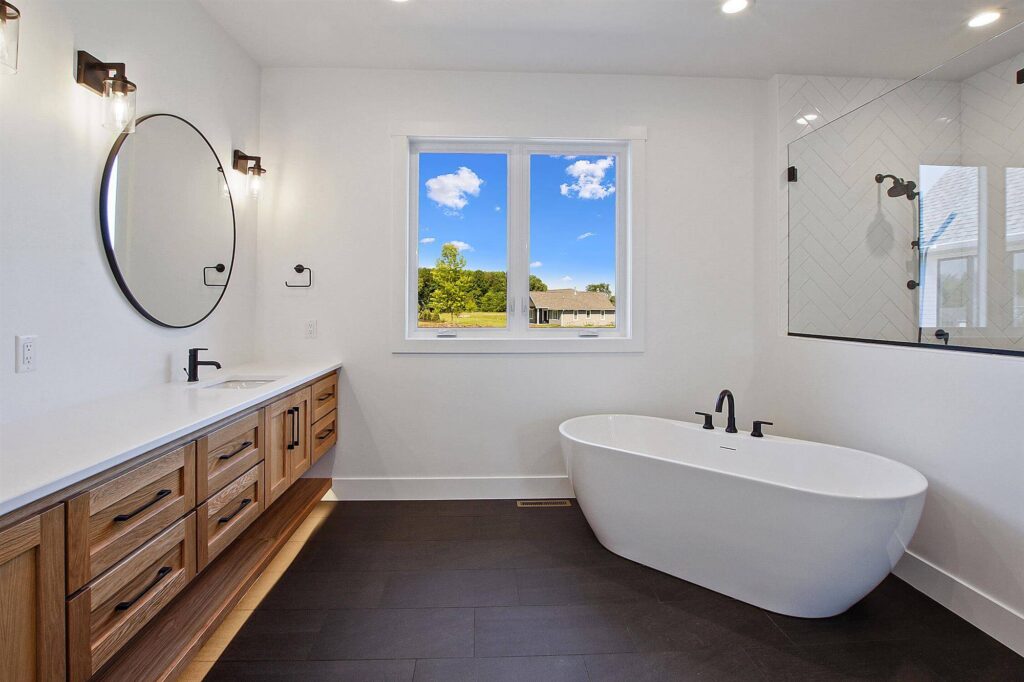 white-bathroom-with-scenic-view-and-double-ended-bathtub
