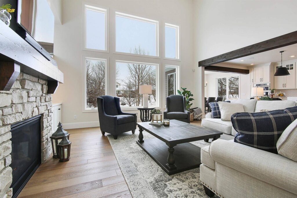 large-entertainment-area-with-dark-wood-beams-and-vaulted-ceilings