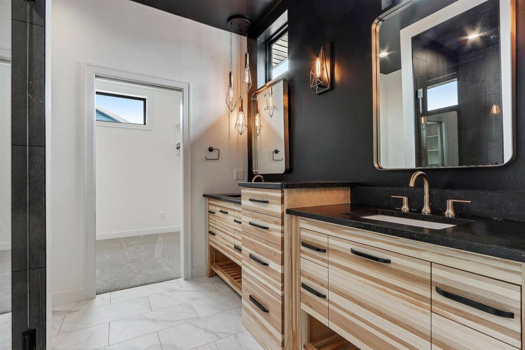 modern-bathroom-with-black-accent-wall-and-gold-accents