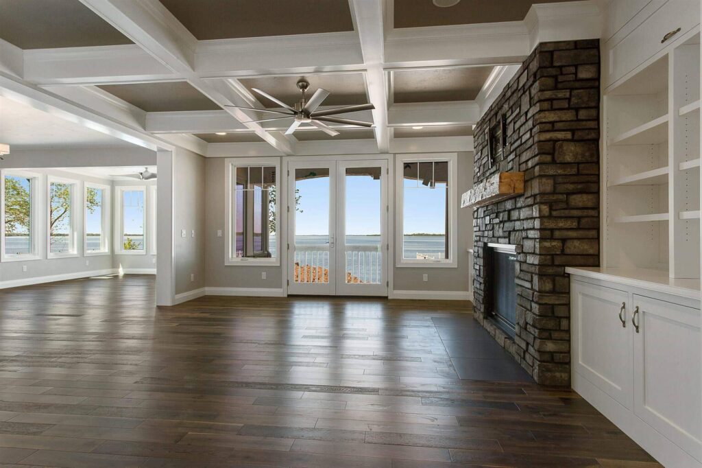 large-entertainment-space-with-coffered-ceiling-and-lake-view
