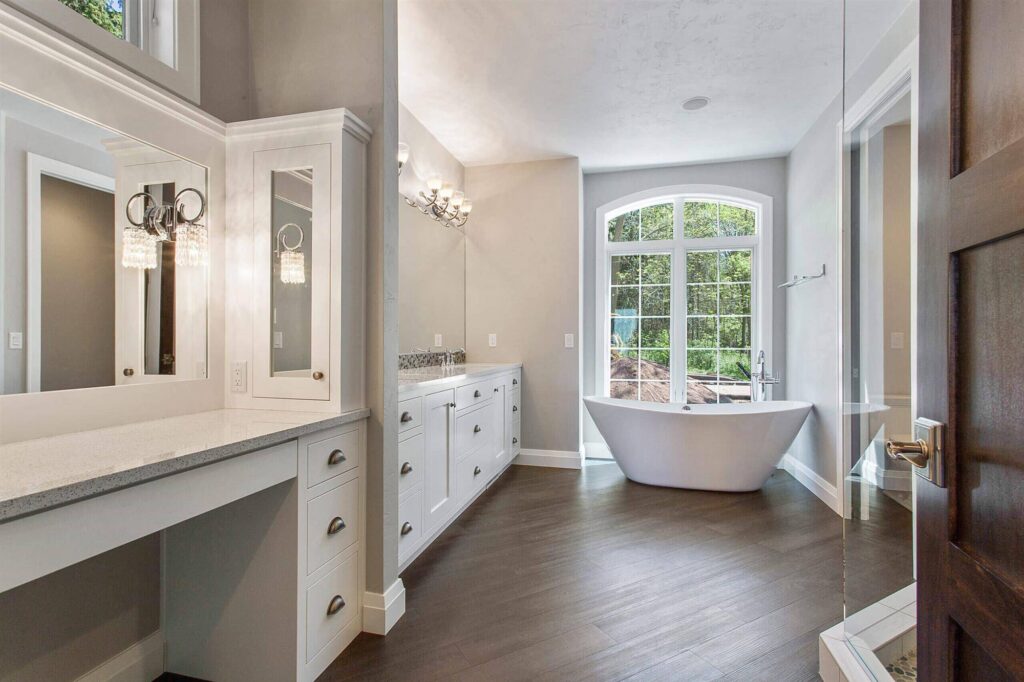 spacious-bathroom-with-makeup-station-and-double-slipper-freestanding-tub