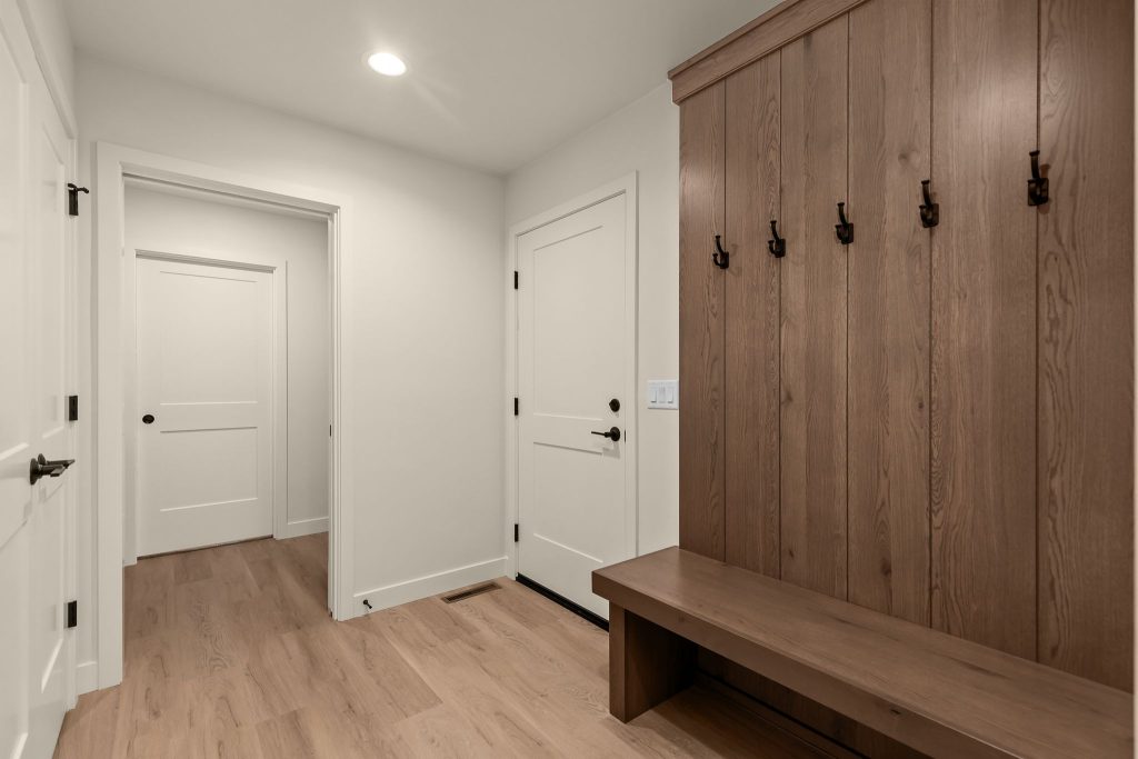 Functional back entry mudroom with built-in storage and bench seating